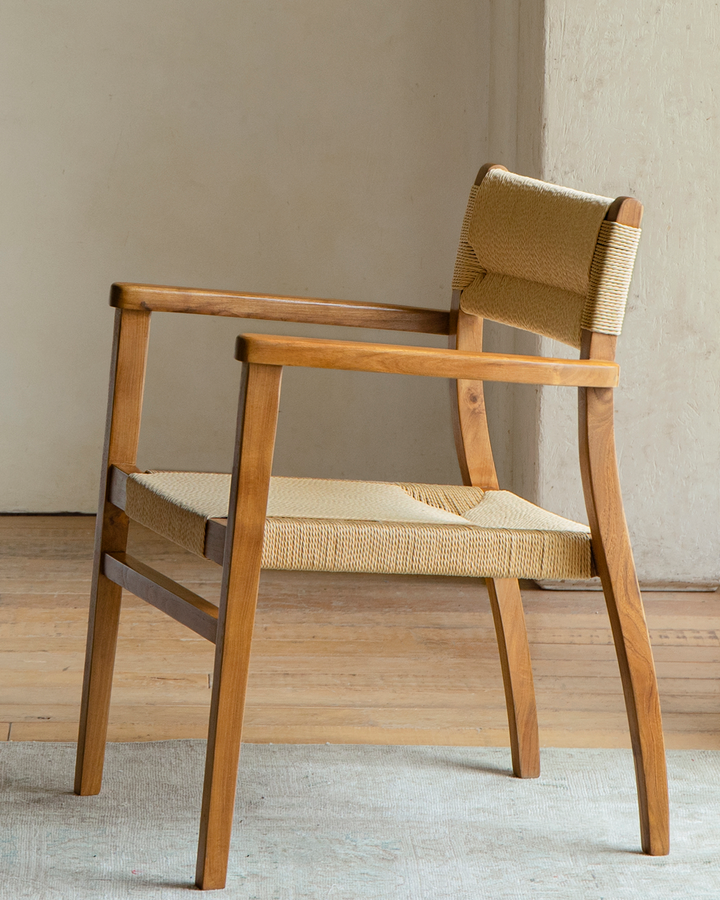 Reed Chair in teak with woven seat and backrest, designed for comfort and style.