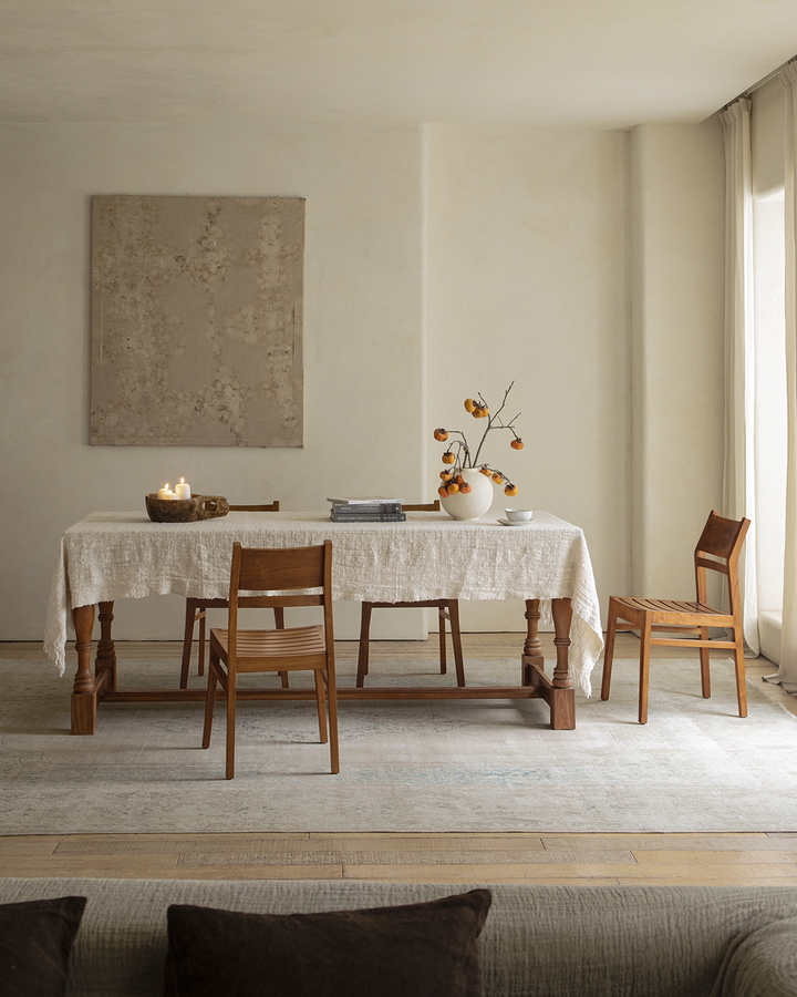 Beam Chair in cozy dining room setting with wooden table and minimalist decor.