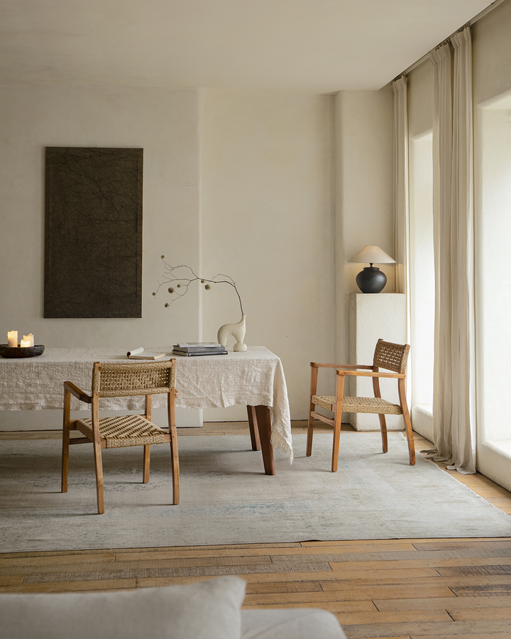 Reed Chair in a modern dining setting with natural light and minimal decor.