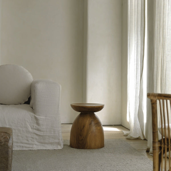 Sandglass Table in a minimalist living room with soft textures