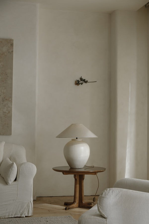 Cozy living room with a white egg lamp on a wooden side table